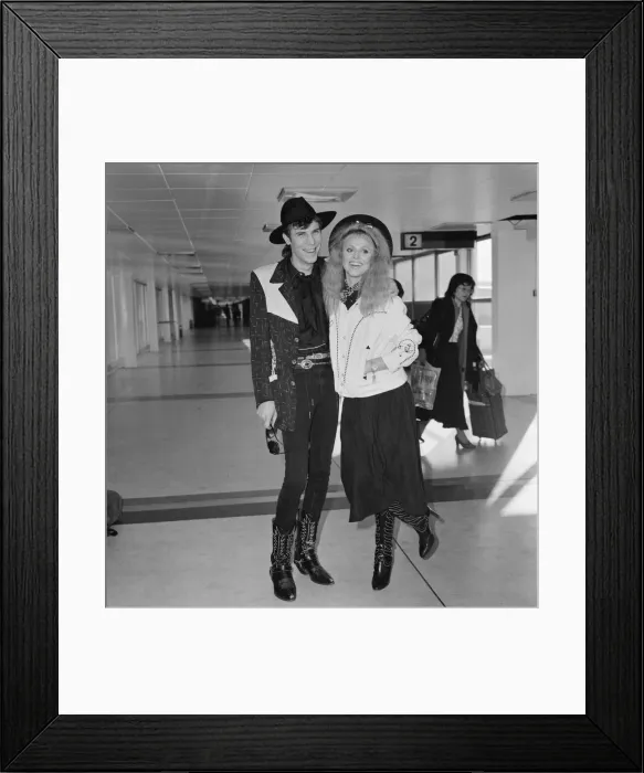 Framed Print : Britt Ekland with boyfriend Slim Jim McDonnell at Heathrow Airport. 16th November 1982 Framed Print : Britt Ekland with boyfriend Slim Jim McDonnell at Heathrow Airport. 16th November 1982