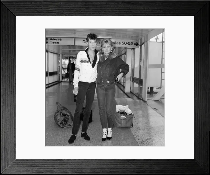 Framed Print : Britt Ekland with boyfriend Slim Jim McDonnell at Heathrow Airport after flying in Framed Print : Britt Ekland with boyfriend Slim Jim McDonnell at Heathrow Airport after flying in