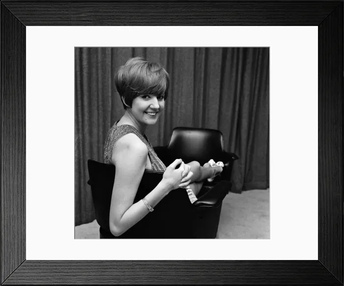Framed Print : Cilla Black relaxes between shots at the filming of The Beatles spectacular at Granda TV