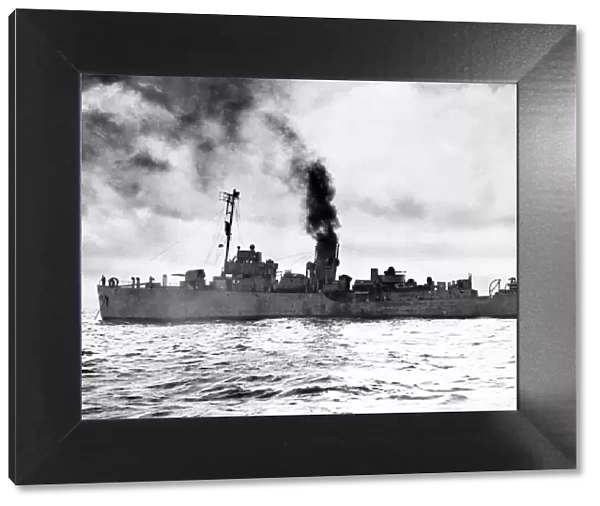 The Flower class corvette HMS Camellia (K31) getting up steam before escorting a convoy
