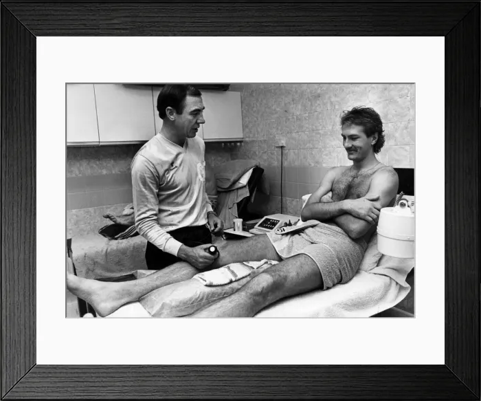 Framed Print : George Dalton, Physiotherapist, Coventry City Football Club, treating player Kevan Smith
