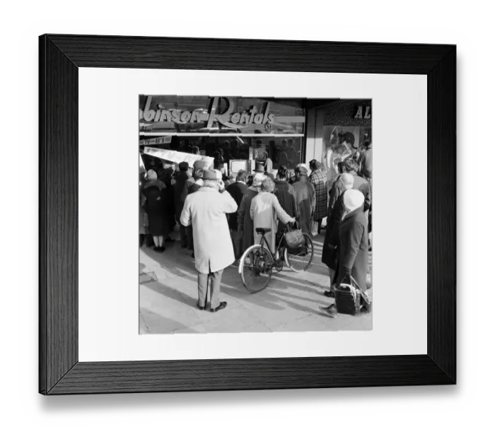 Framed Print : Shoppers watch Sir Winston Churchill state funeral through shop window of Robinson
