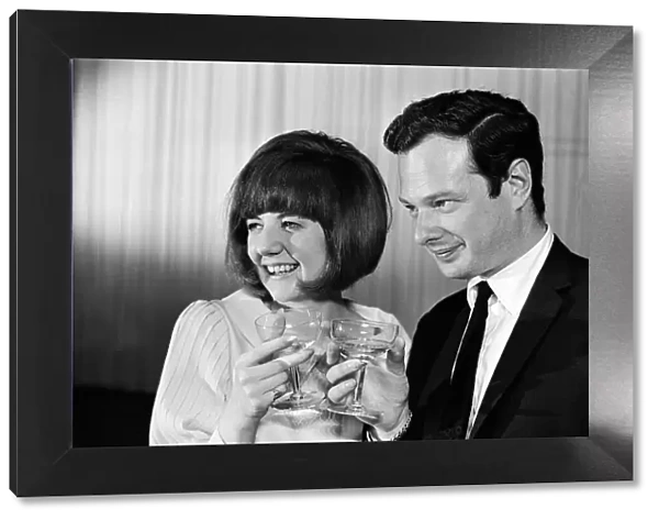 Cilla Black with Brian Epstein, at her 21st birthday party. 27th May 1964