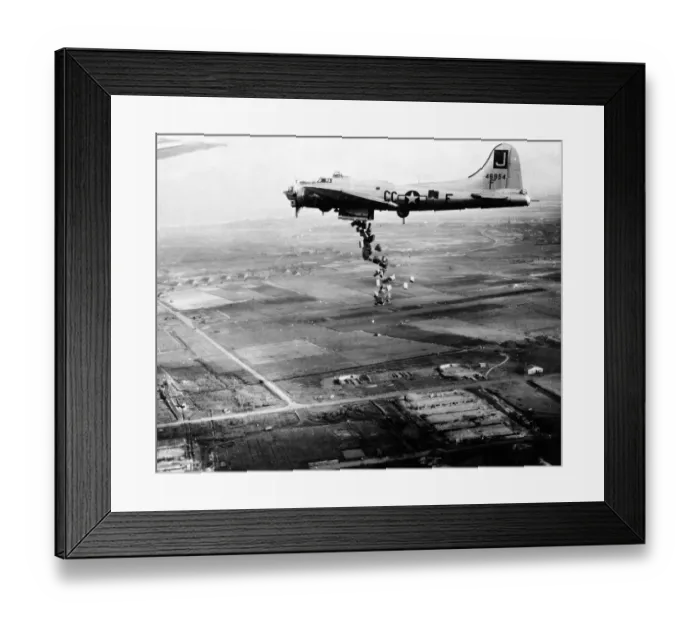 Framed Print : Starving Dutch population bombed with food -- streaming from the bomb bay of a Framed Print : Starving Dutch population bombed with food -- streaming from the bomb bay of a