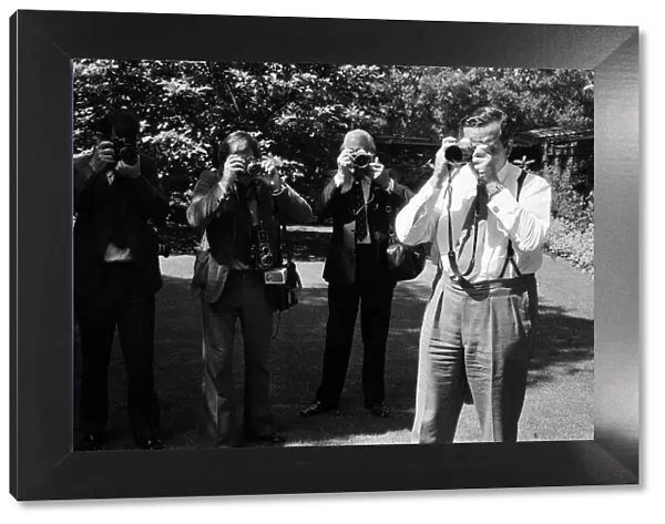 Chancellor of the Exchequer Denis Healey with photographers in the garden of Number 11