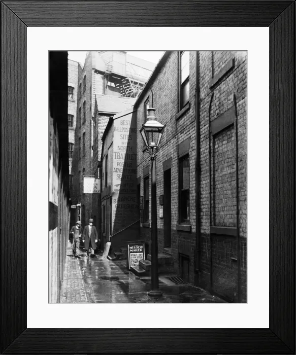 Framed Print : Newcastles early morning workers walk through the lighted Forth Lane in Framed Print : Newcastles early morning workers walk through the lighted Forth Lane in