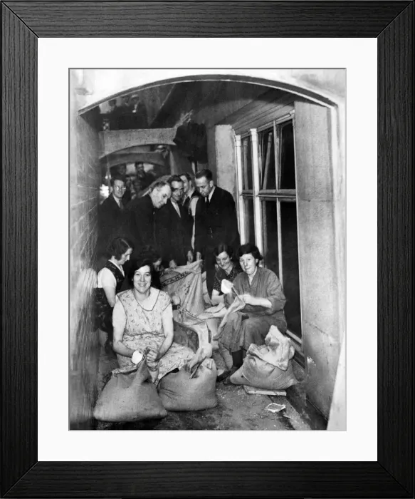 Framed Print : Making sandbags in the shelter - Women are making and men filling sandbags in Framed Print : Making sandbags in the shelter - Women are making and men filling sandbags in