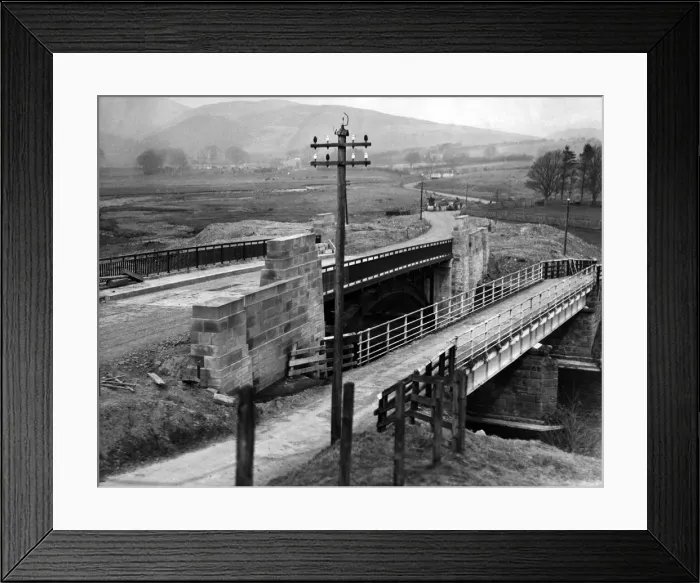 Framed Print : The road improvement scheme near Alwinton, which shows the new bridge alongside the old Framed Print : The road improvement scheme near Alwinton, which shows the new bridge alongside the old