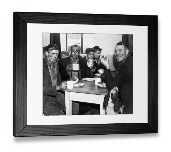 Framed Print : A group of miners enjoying a meal after the opening of a pithead canteen at Isabella Pit