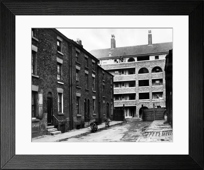 Framed Print : Inadequate accommodation is a characteristic of those slum areas where delinquency is