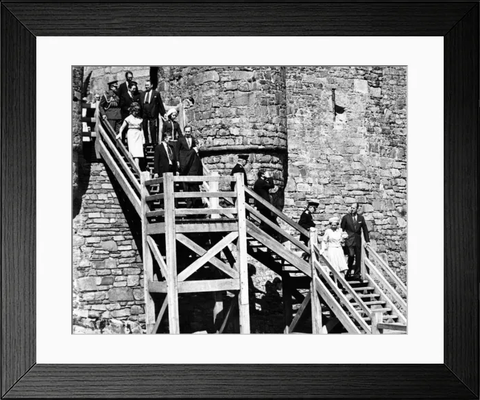 Framed Print : Queen Elizabeth II and The Duke of Edinburgh lead the party down the wooden steps as Framed Print : Queen Elizabeth II and The Duke of Edinburgh lead the party down the wooden steps as