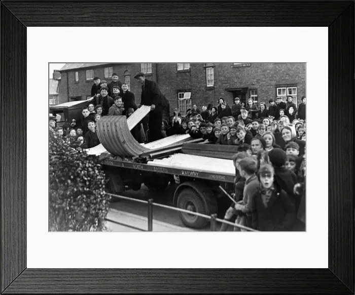 Framed Print : A crowd of excited youngsters watched the delivery of the first consignment of A. R. P Framed Print : A crowd of excited youngsters watched the delivery of the first consignment of A. R. P