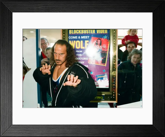 Framed Print : Wolf from Gladiators opening the new Blockbuster Video in Reading. 6th November 1994 Framed Print : Wolf from Gladiators opening the new Blockbuster Video in Reading. 6th November 1994