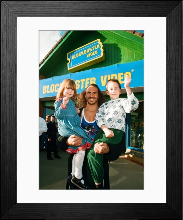 Framed Print : Wolf from Gladiators opening the new Blockbuster Video in Reading. 6th November 1994 Framed Print : Wolf from Gladiators opening the new Blockbuster Video in Reading. 6th November 1994