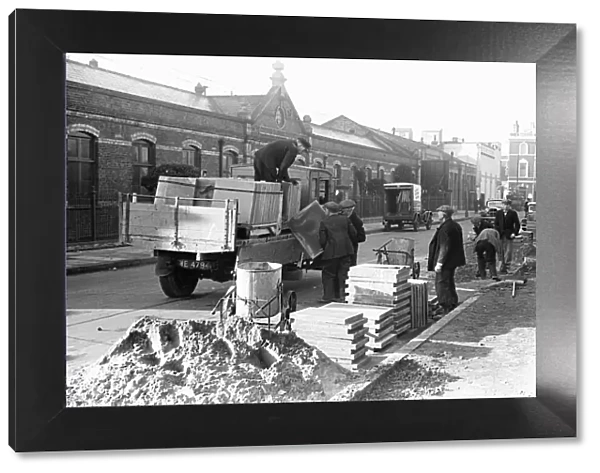 Kingston Council workmen seen here replacing the pavement just off off Kingston High