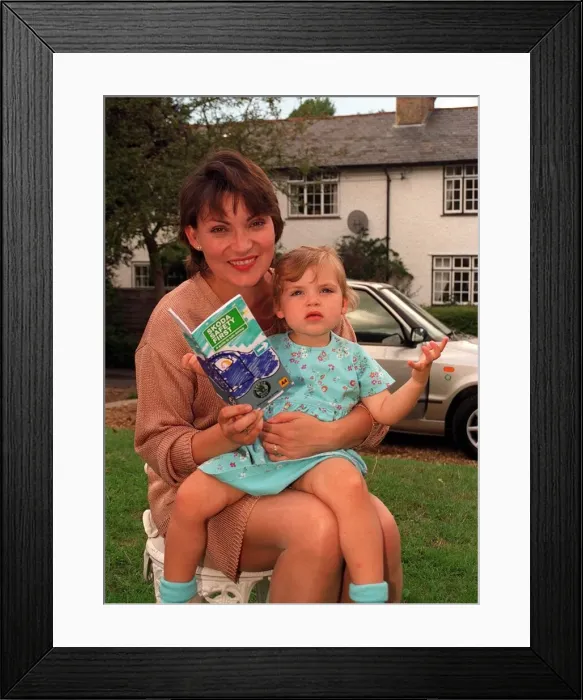 Framed Print : Lorraine Kelly the television presenter with her daughter holding a road safety leaflet Framed Print : Lorraine Kelly the television presenter with her daughter holding a road safety leaflet