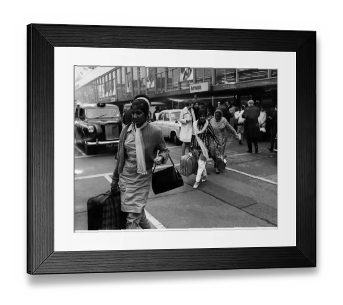 Framed Print : Indian and Pakistani immigrants arrive onto British soil at Heathrow Airport
