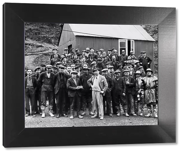The first bar of gold at Dolaucothi Gold Mine with day shift workers