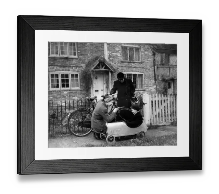 Framed Print : A family pictured in Charlwood, Surrey, during World War Two. 12th December 1943 Framed Print : A family pictured in Charlwood, Surrey, during World War Two. 12th December 1943