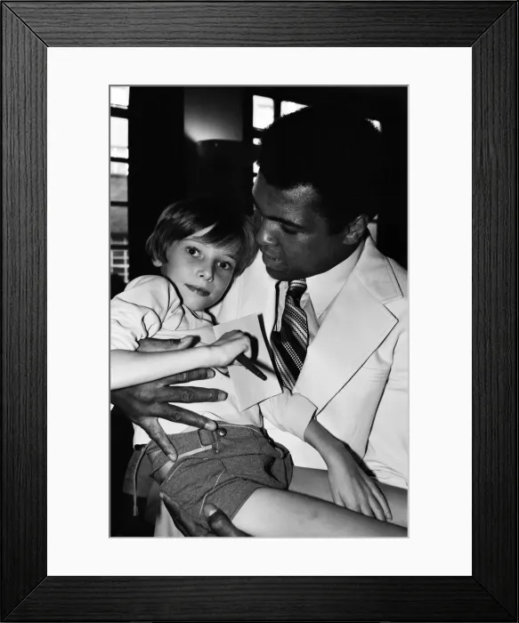 Framed Print : World heavyweight boxing champion Muhammad Ali presented a sunshine coach on the behalf Framed Print : World heavyweight boxing champion Muhammad Ali presented a sunshine coach on the behalf