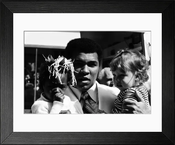 Framed Print : World heavyweight boxing champion Muhammad Ali presented a sunshine coach on the behalf