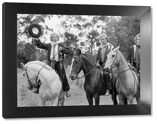 The Police, pop  /  rock group, pictured on horses. Left is guitarist Andy