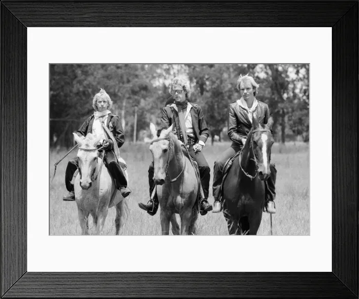 Framed Print : The Police, pop  /  rock group, pictured on horses. Left is guitarist Andy
