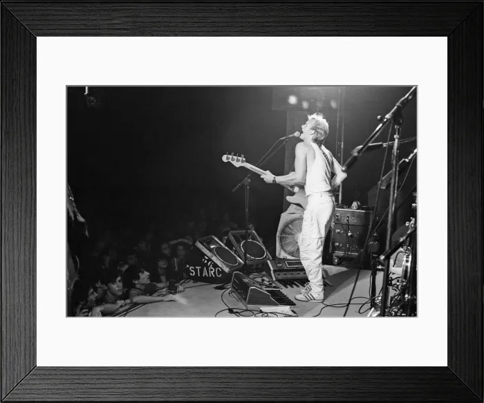 Framed Print : Sting, from the pop / rock group The Police. Pictured here on stage Framed Print : Sting, from the pop / rock group The Police. Pictured here on stage
