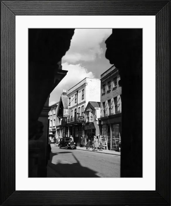 Framed Print : A view taken through an old archway off the main street in the old town of Hemel Framed Print : A view taken through an old archway off the main street in the old town of Hemel