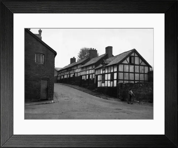 Framed Print : Black and white cottages in the town of Llandidloes in Montgomeryshire, Wales Framed Print : Black and white cottages in the town of Llandidloes in Montgomeryshire, Wales