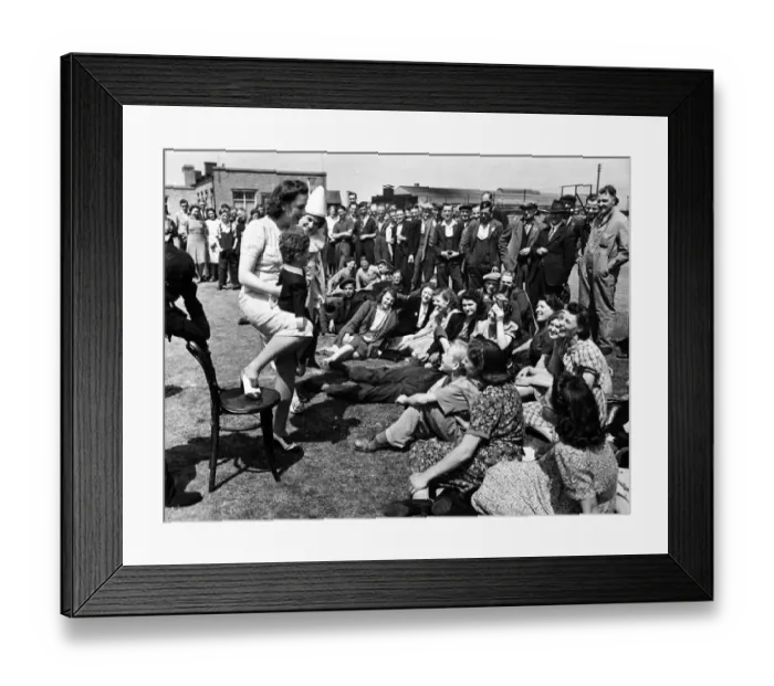 Framed Print : Female ventriloquist entertaining workers during the second world war. 30th June 1942