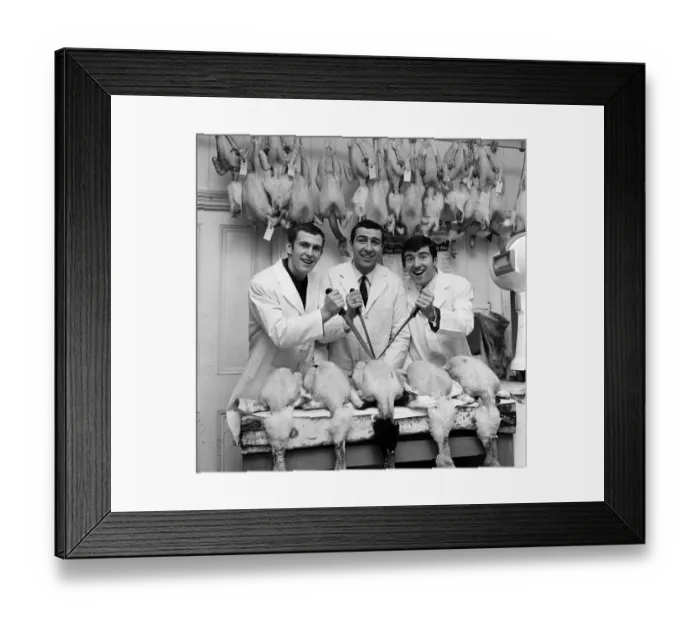 Framed Print : West Ham winger Peter Brabrook who has a butchers shop in East London was assisted