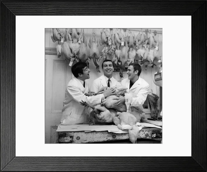 Framed Print : West Ham winger Peter Brabrook who has a butchers shop in East London was assisted