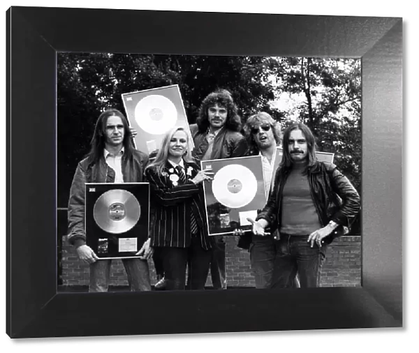 Status Quo, are presented with more Gold and Platinum Discs at The Eurocrest Hotel