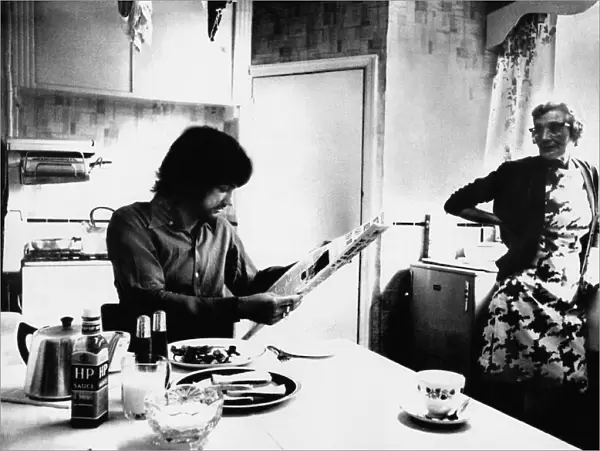 Manchester Uniteds George Best enjoys breakfast as landlady Mary Fullaway looks