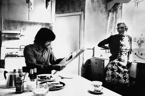 Manchester Uniteds George Best enjoys breakfast as landlady Mary Fullaway looks