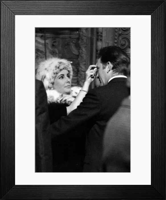Framed Print : Elizabeth Taylor and Richard Burton on the set where Richard is filming a poetry Framed Print : Elizabeth Taylor and Richard Burton on the set where Richard is filming a poetry