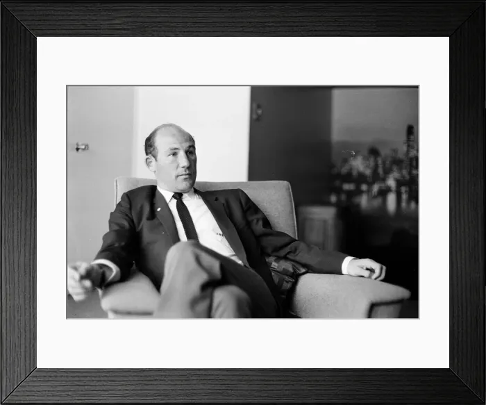 Framed Print : Stirling Moss Pictured during his 1964 interview with The Mirror