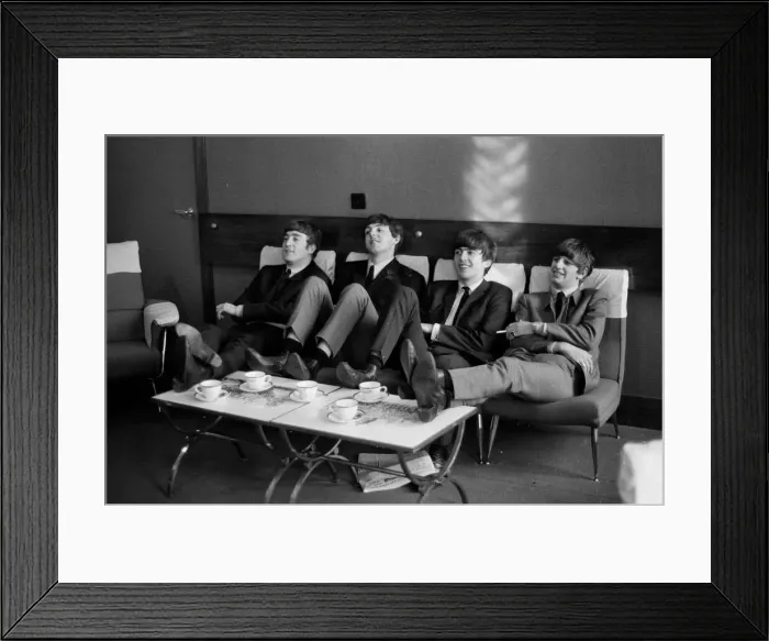 Framed Print : The Beatles relax during rehearsals at The Prince of Wales Theatre in London for