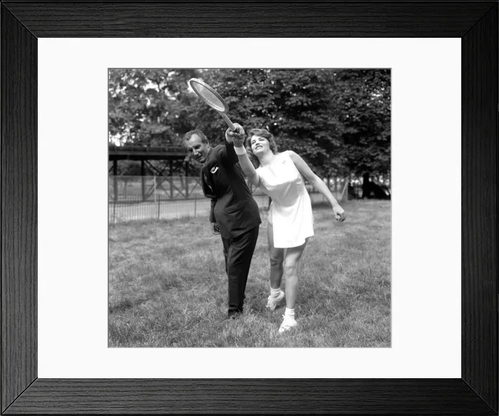 Framed Print : Fred Perry with actress Yvonne Buckingham, during a coaching session Framed Print : Fred Perry with actress Yvonne Buckingham, during a coaching session