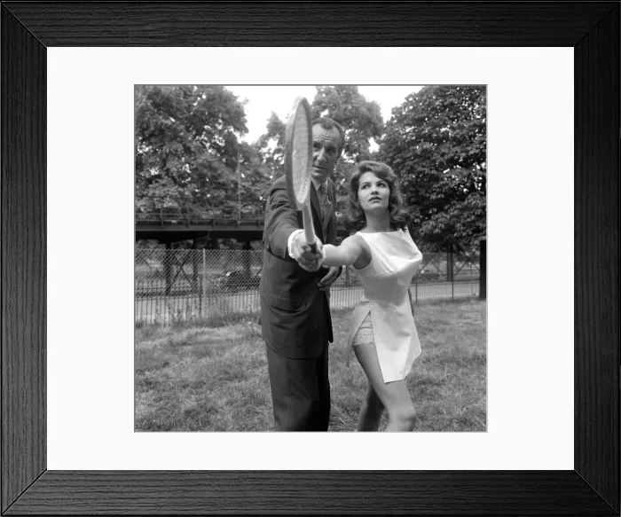 Framed Print : Fred Perry with actress Yvonne Buckingham, during a coaching session Framed Print : Fred Perry with actress Yvonne Buckingham, during a coaching session