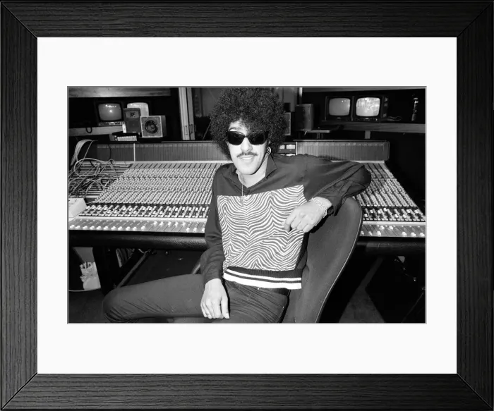 Framed Print : Phil Lynott of Thin Lizzy during a recording session for the groups new album Framed Print : Phil Lynott of Thin Lizzy during a recording session for the groups new album