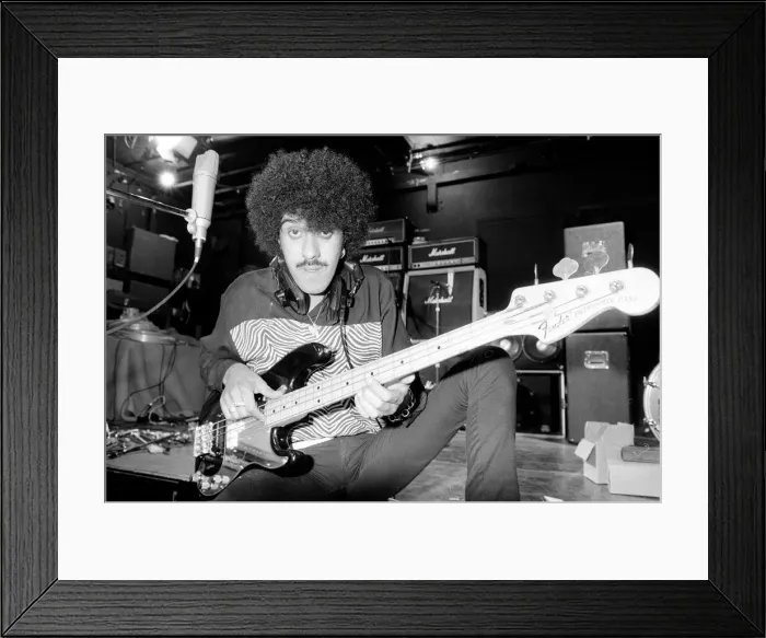 Framed Print : Phil Lynott of Thin Lizzy during a recording session for the groups new album Framed Print : Phil Lynott of Thin Lizzy during a recording session for the groups new album