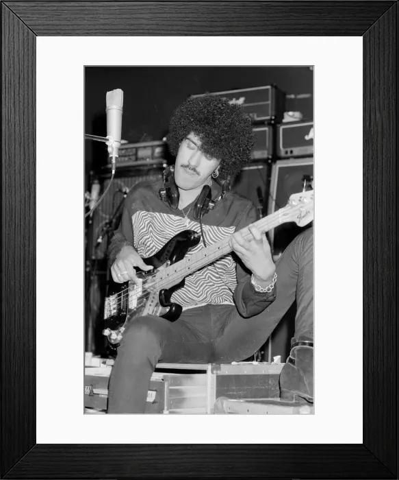 Framed Print : Phil Lynott of Thin Lizzy during a recording session for the groups new album Framed Print : Phil Lynott of Thin Lizzy during a recording session for the groups new album