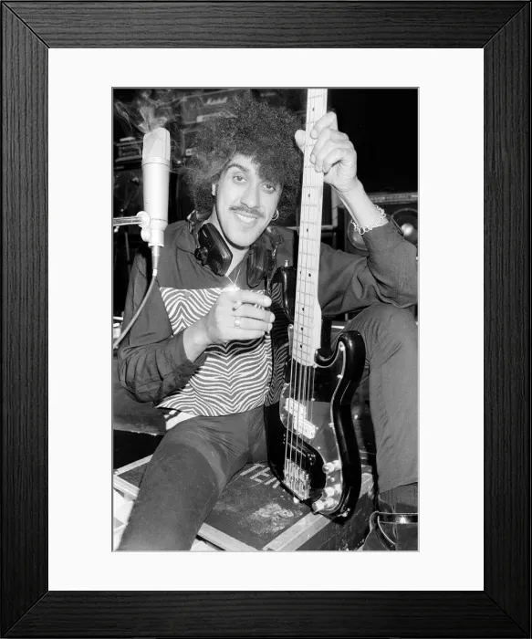 Framed Print : Phil Lynott of Thin Lizzy during a recording session for the groups new album Framed Print : Phil Lynott of Thin Lizzy during a recording session for the groups new album