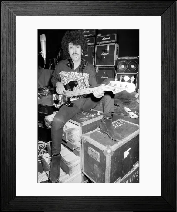 Framed Print : Phil Lynott of Thin Lizzy during a recording session for the groups new album Framed Print : Phil Lynott of Thin Lizzy during a recording session for the groups new album