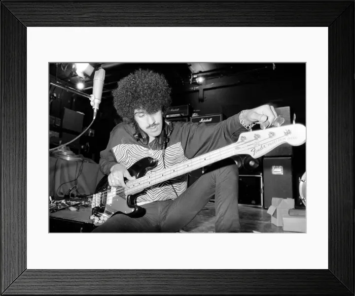 Framed Print : Phil Lynott of Thin Lizzy during a recording session for the groups new album Framed Print : Phil Lynott of Thin Lizzy during a recording session for the groups new album