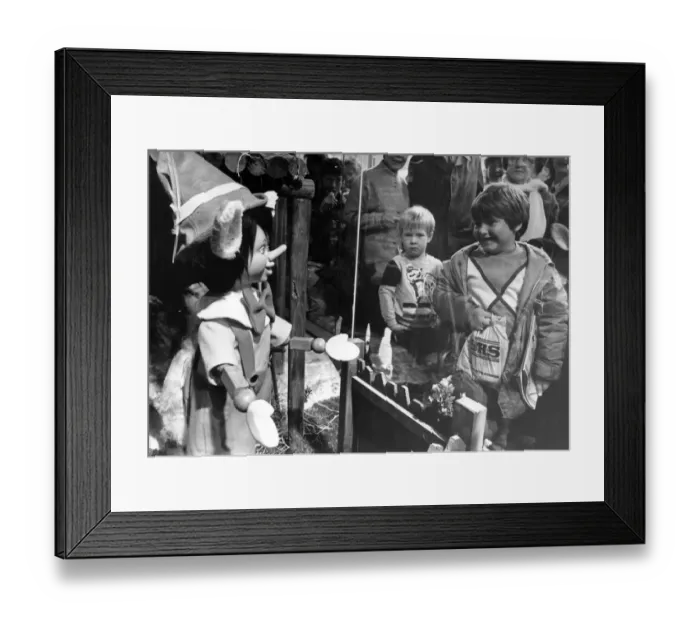 Framed Print : Children meet Pinocchio through the window of the Fenwick store in Newcastle Framed Print : Children meet Pinocchio through the window of the Fenwick store in Newcastle