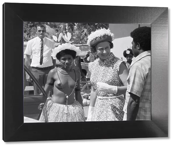 HRH Queen Elizabeth II seen here being greeted by official in Western Samoa during her