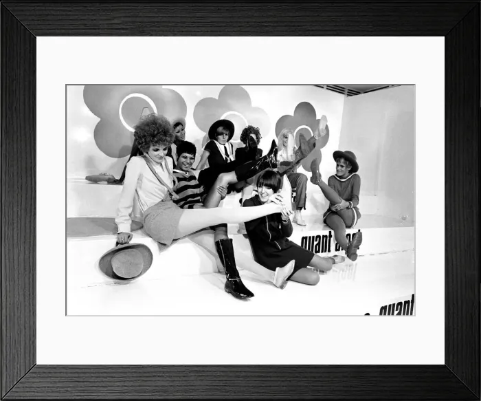Framed Print : Mary Quant pictured in black, sitting down at the front